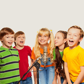 Classmates singing together standing with microphone